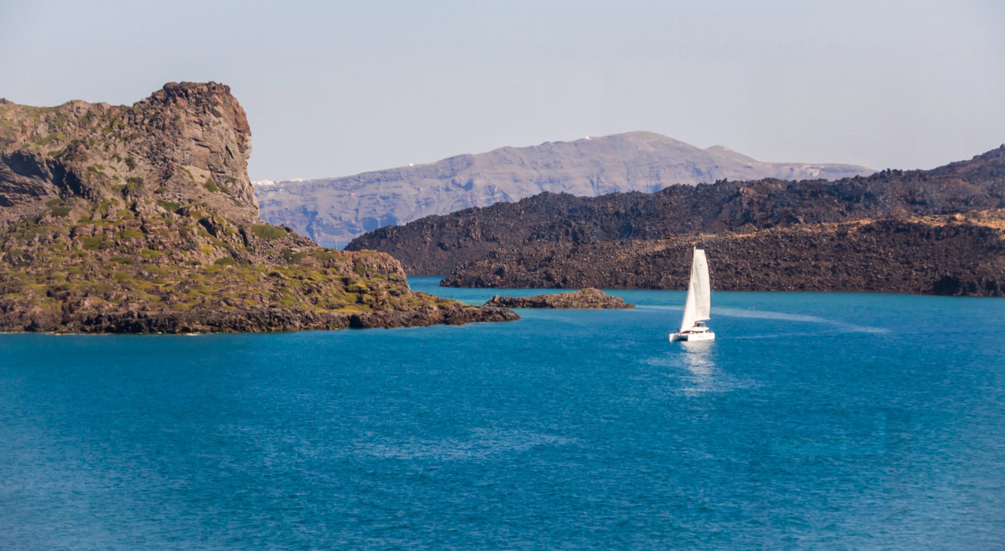 catamaran enters the bay of Thira (Santorini)
