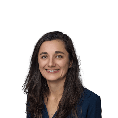 Headshot of smiling woman with long dark hair against a white background