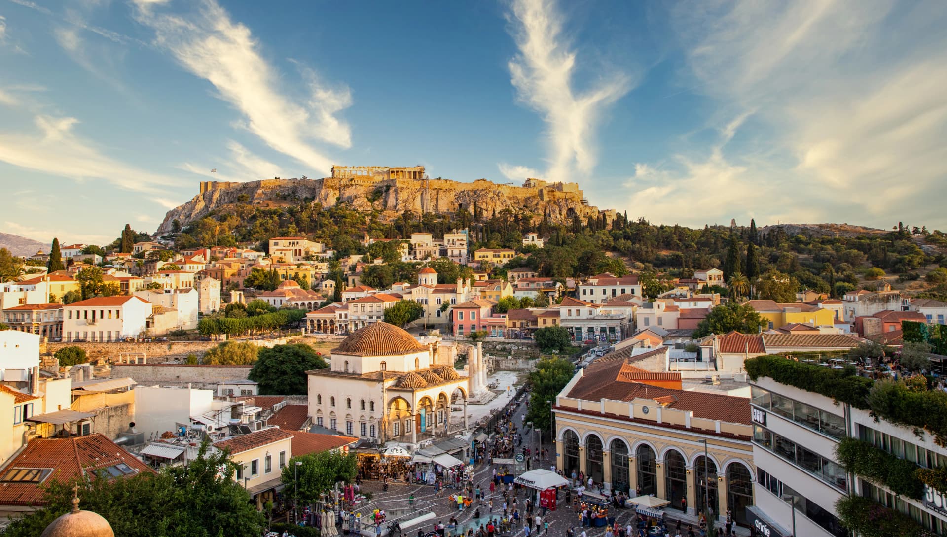 aerial panoramic view of Monastiraki square and the Acropolis at sunset in Athens Greece