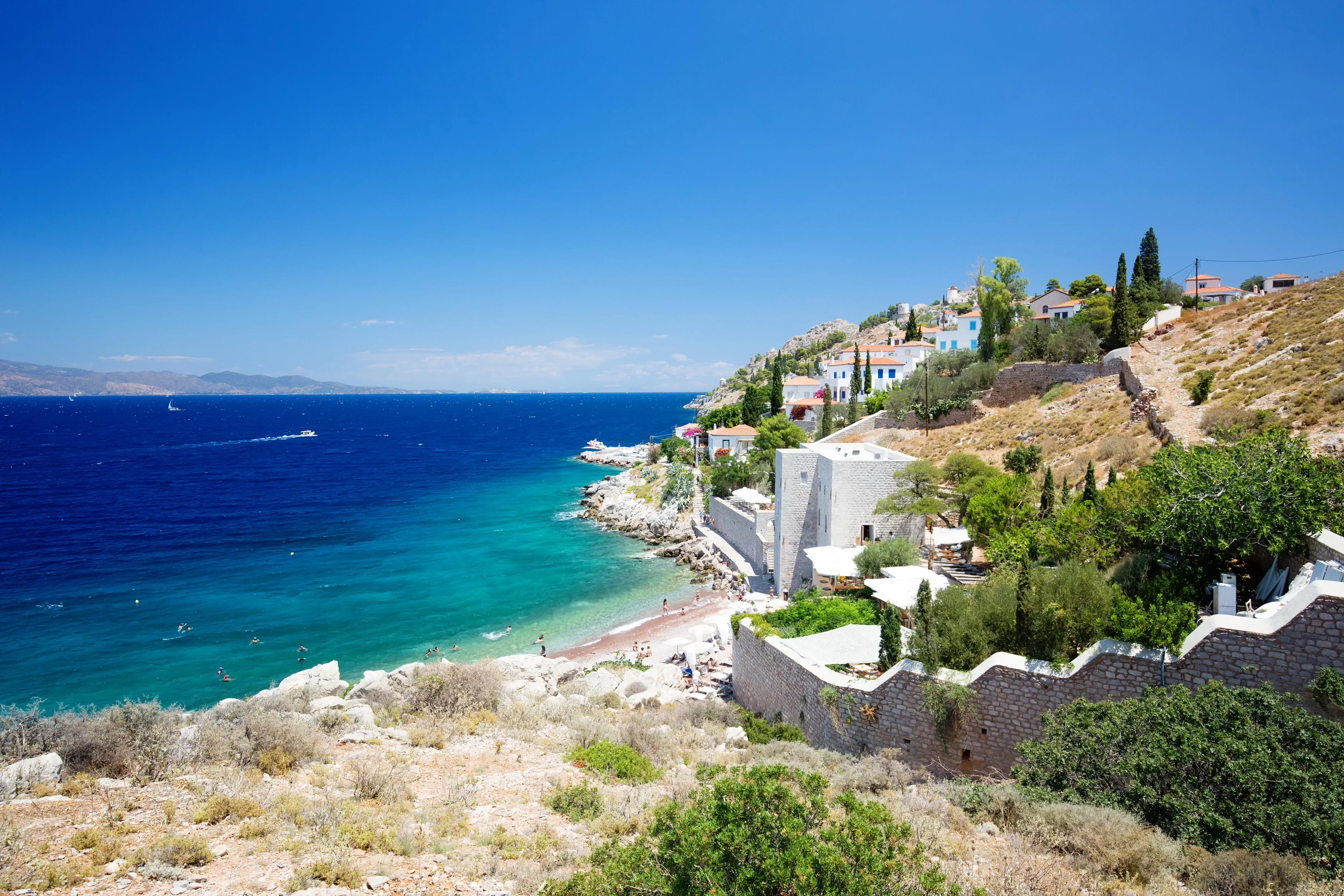 View from Hydra Island. Castello Hydra and Kamini beach. Blue sky