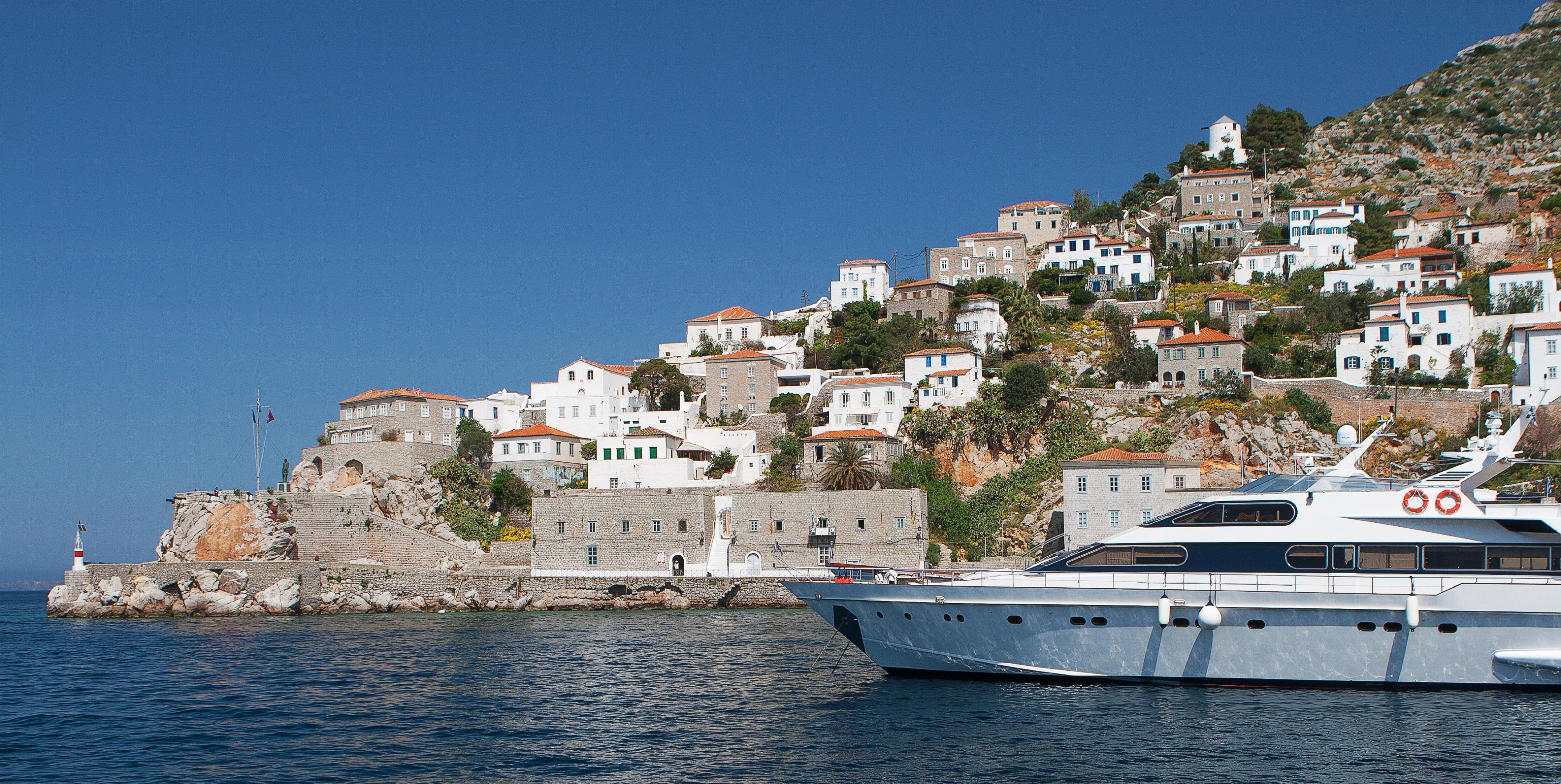 Hydra island with yacht in the foreground