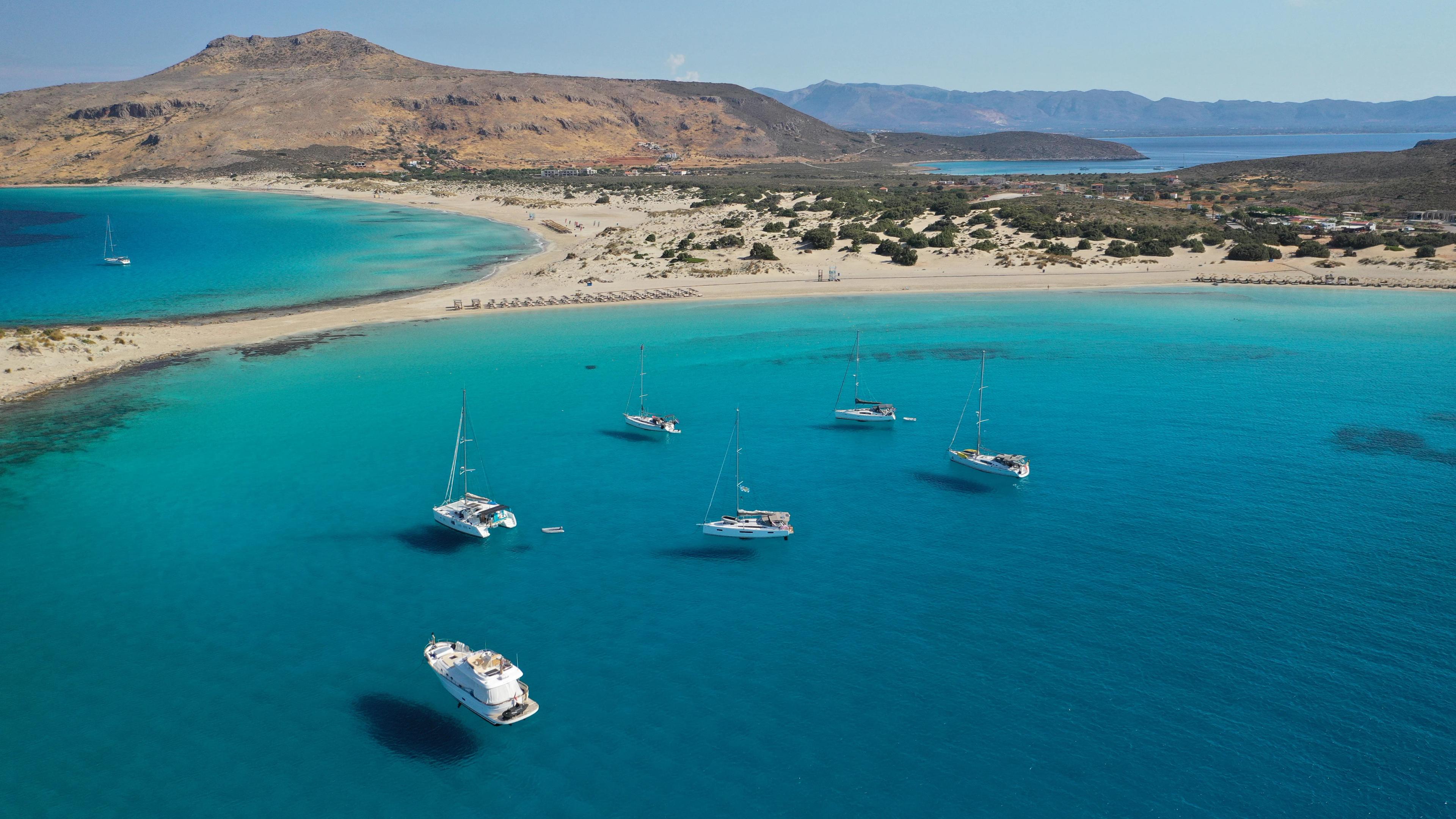 Aerial drone photo of beautiful sandy bay and double turquoise exotic beach of Simos resembling a blue lagoon in small island of Elafonisos, Lakonia, Peloponnese, Greece