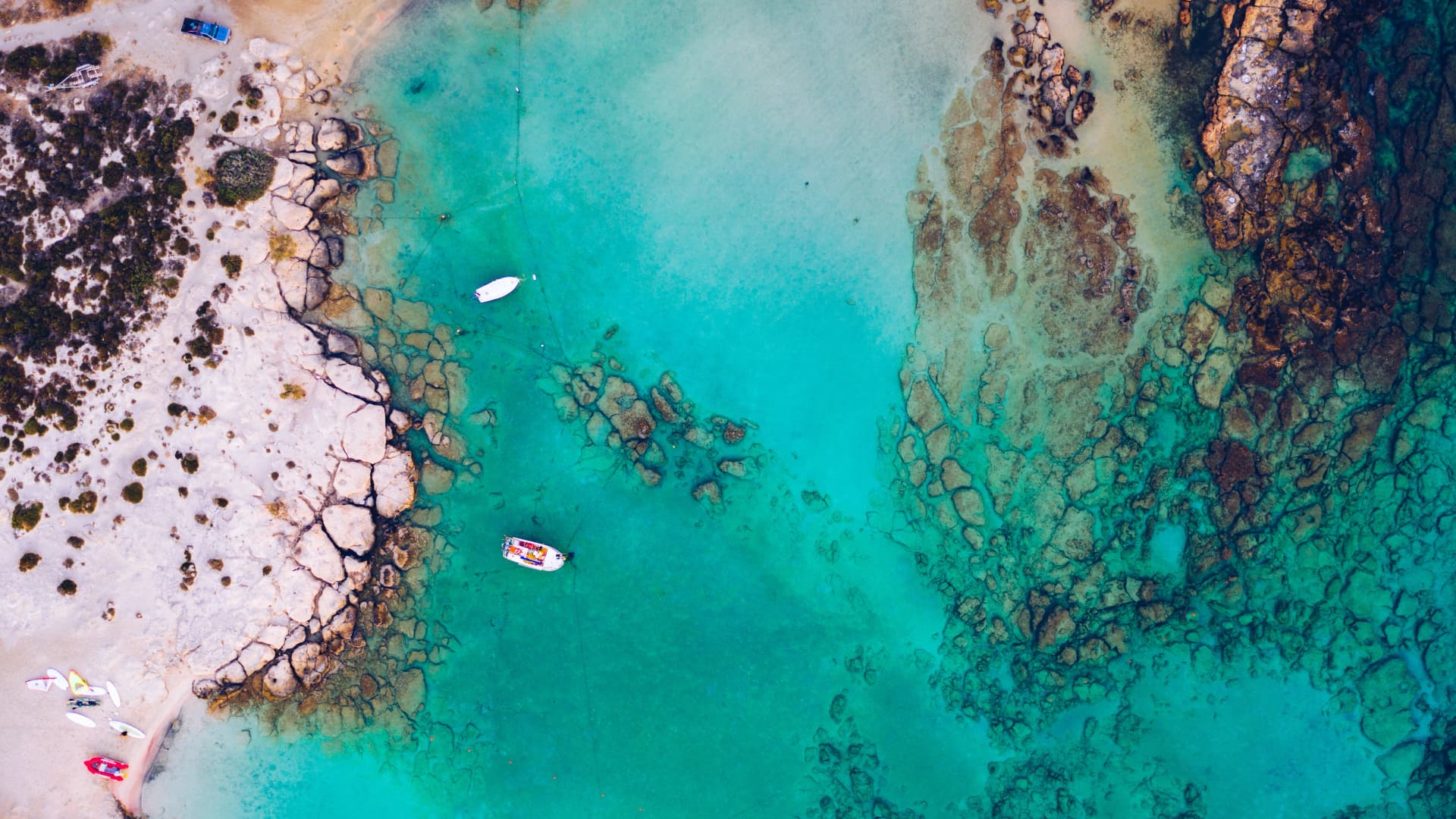 Aerial view of beautiful tropical Elafonissi Beach with pink sand. View of a nice tropical Elafonissi beach from the air. Beautiful sky, sea, resort. Elafonissi beach, Crete, Greece.