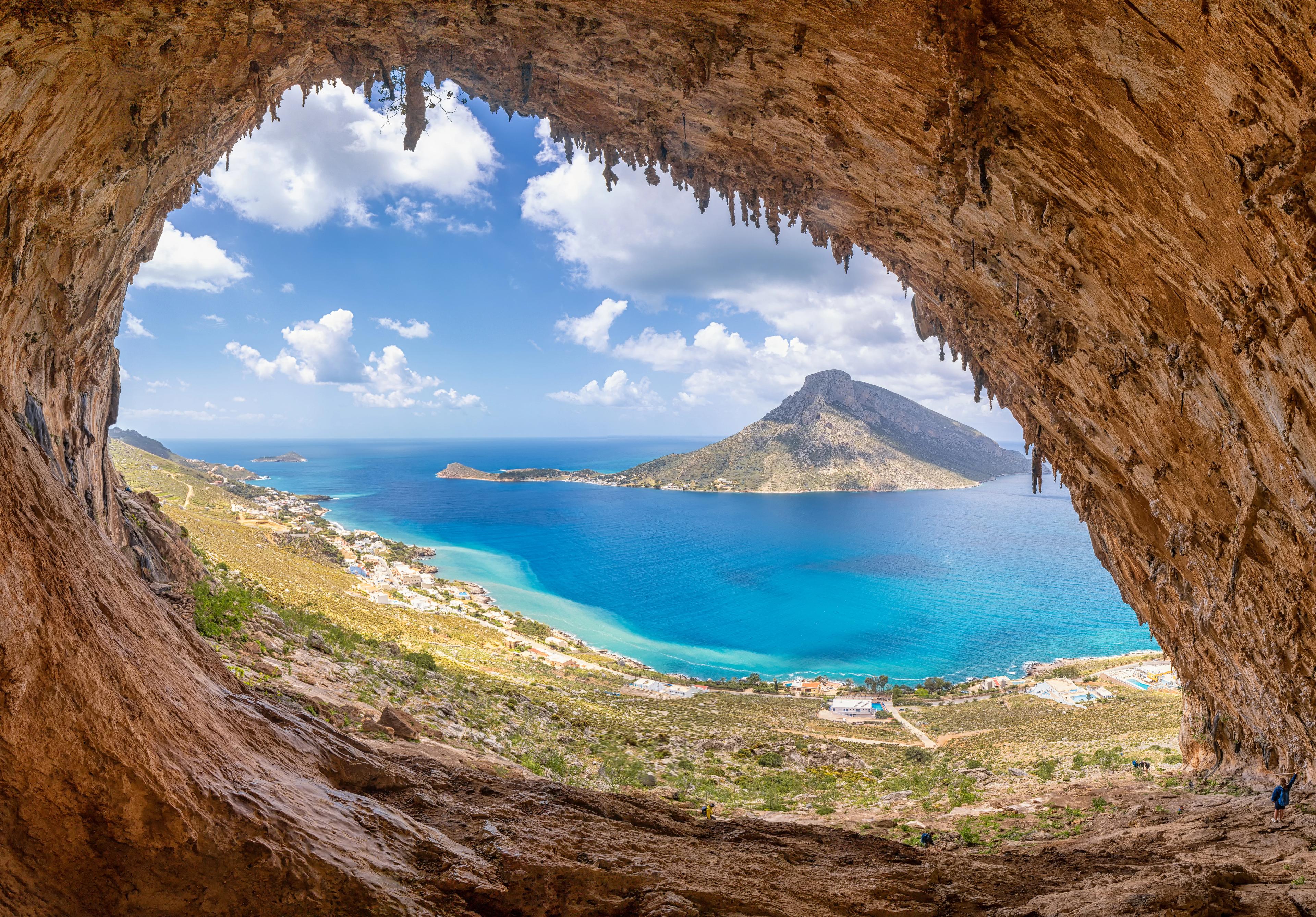 The famous "Grande Grotta", one of the most popular climbing fields of Kalymnos island, Greece. In the background, Telendos island.